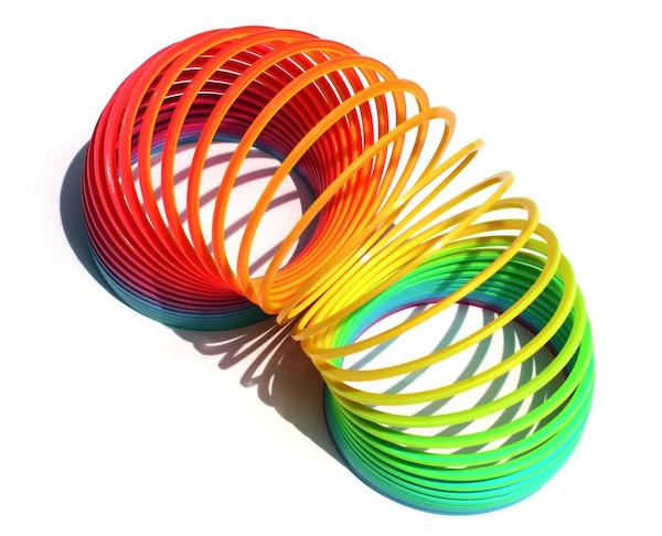 Multi-color Slinky representing Flexible Common sense underwriting.